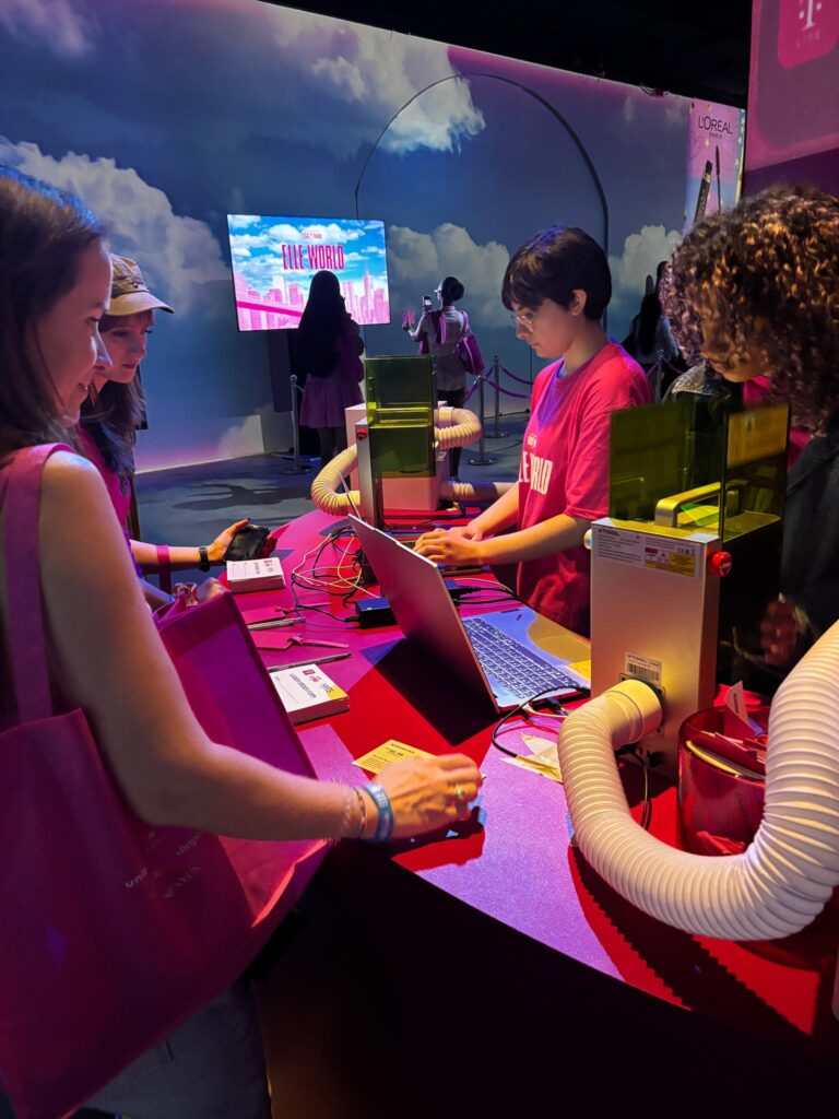Live laser engraving activation at the T-Mobile x ELLE Women of Impact event, creating personalized gifts for guests during a luxury experiential marketing event.