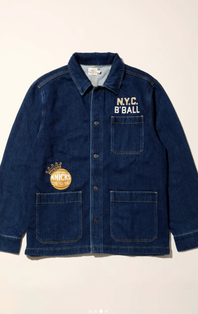 Close-up of premium custom embroidery on a label for the Faherty Brand and NY Knicks championship denim jacket project.