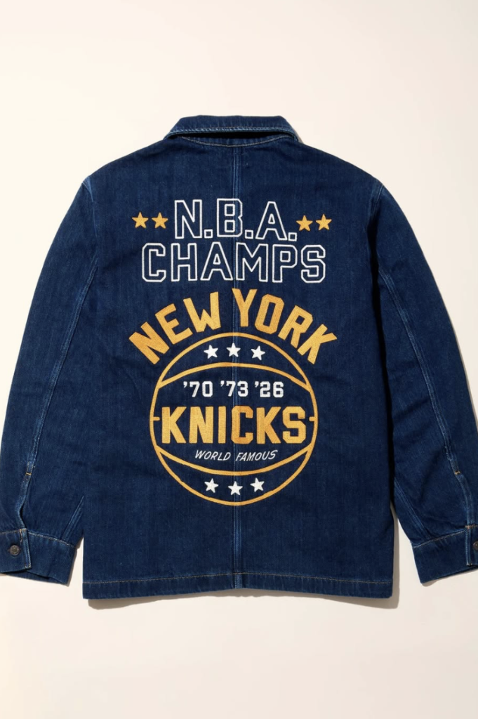 Precision embroidery work featuring the text Champions on the court. Crafted in New York for Faherty Brand.