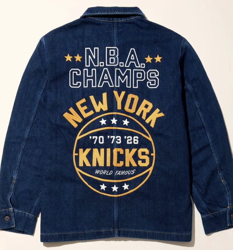 Precision embroidery work featuring the text Champions on the court. Crafted in New York for Faherty Brand.
