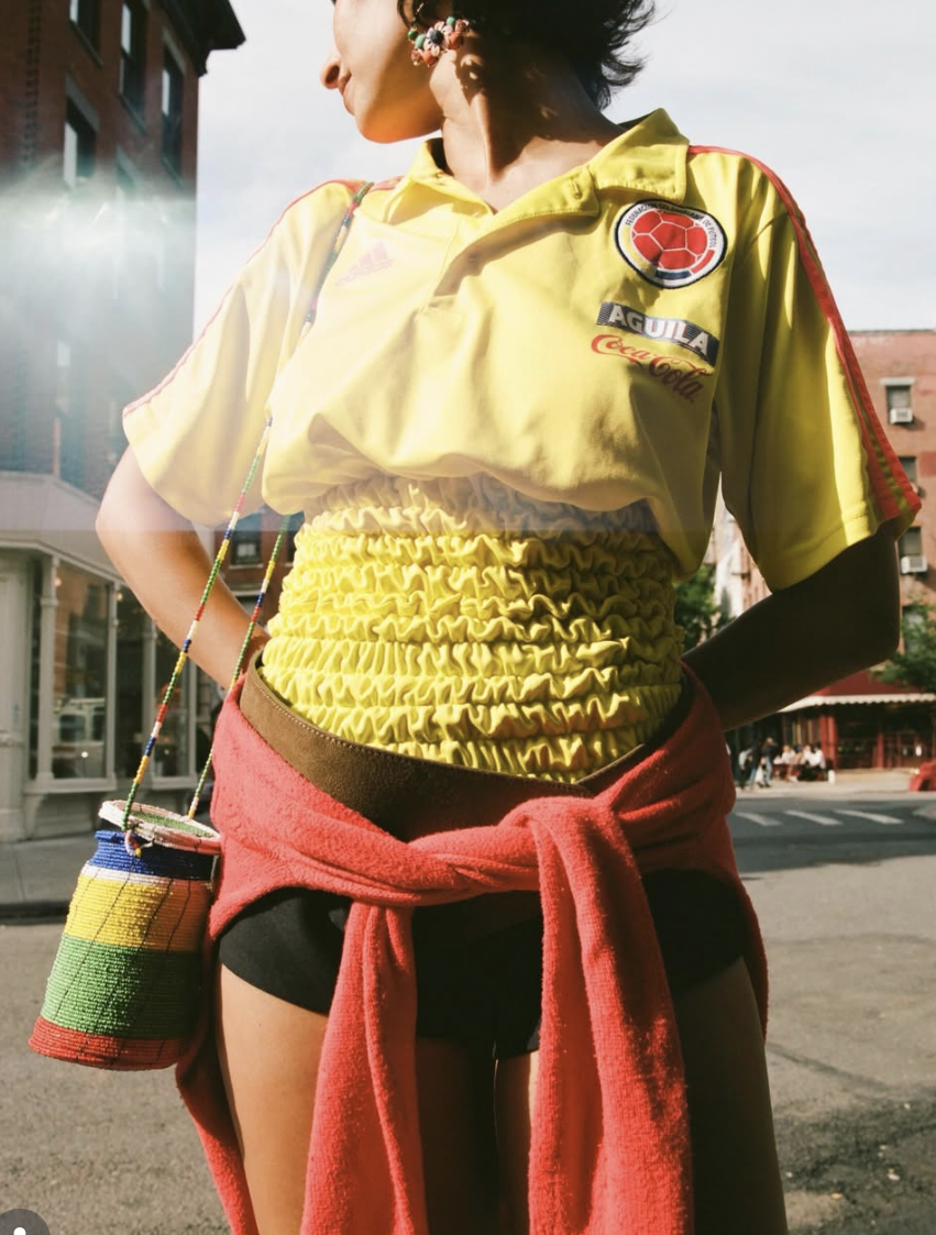 A complete one-of-one designer soccer jersey reconstructed from a vintage kit featuring custom hand-smocked panel detailing.