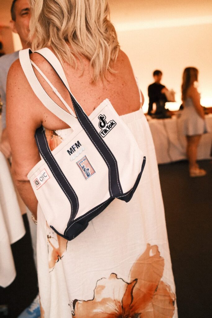 NYES team member heat pressing a custom patch onto apparel during the QVC x TikTok live brand activation.