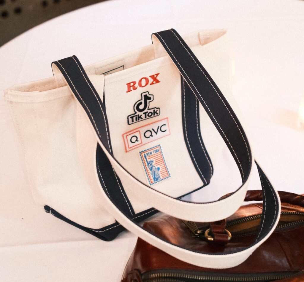 NYES team member heat pressing a custom patch onto apparel during the QVC x TikTok live brand activation.