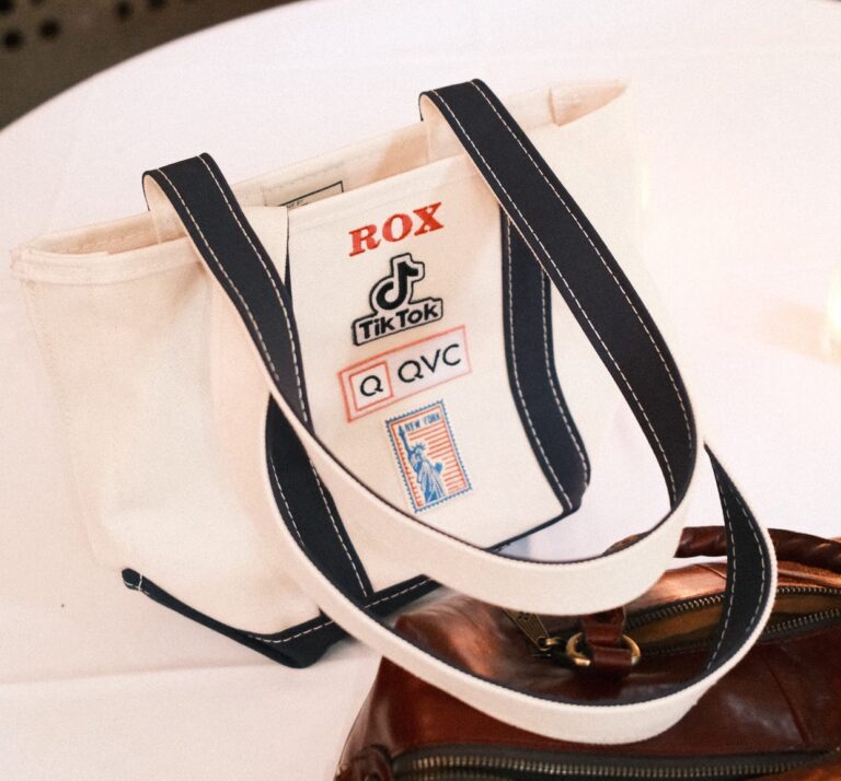 NYES team member heat pressing a custom patch onto apparel during the QVC x TikTok live brand activation.