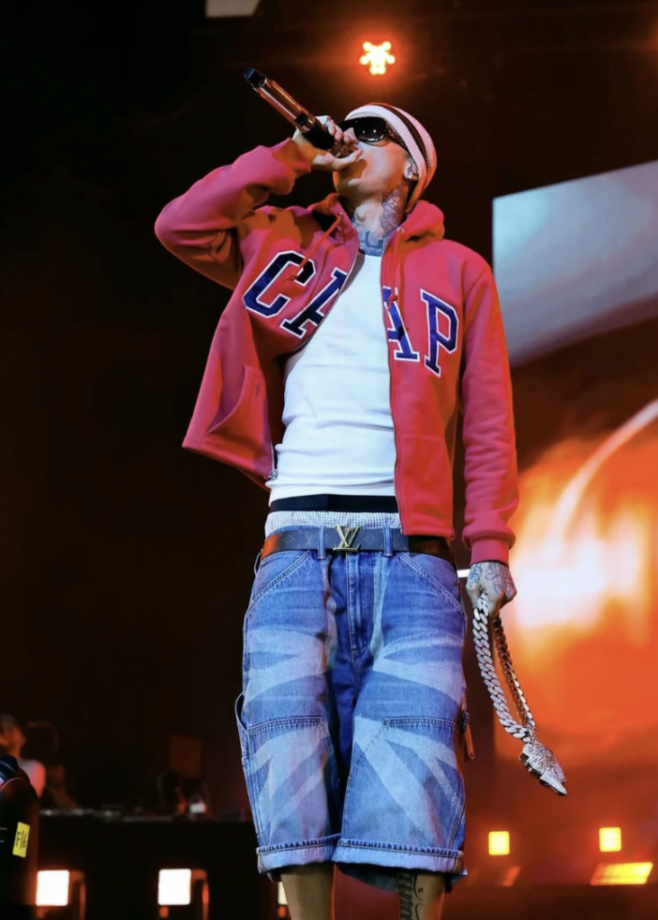 Central Cee performing on stage at Coachella wearing a custom designed outfit by GAP featuring specialized washed denim.