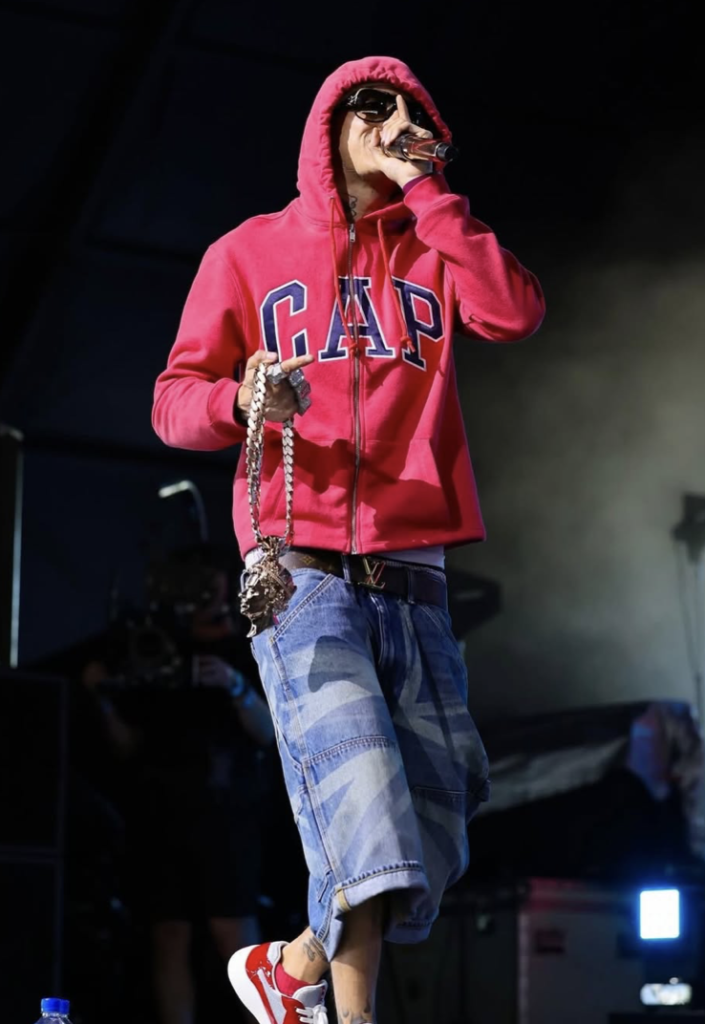 Central Cee performing on stage at Coachella wearing a custom designed outfit by GAP featuring specialized washed denim.