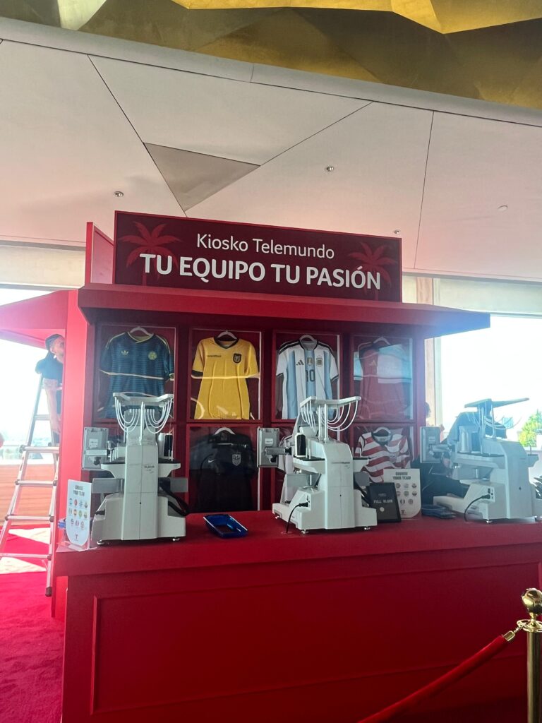 Live embroidery station personalizing team jerseys during the NYNJ Fan Village at Rockefeller Center.